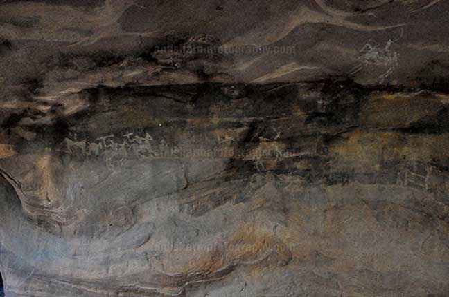 Archaeology- Bhimbetka Rock Shelters - Prehistoric Roak Painting showing hunters riding horses in white color at Bhimbetka. by Anil Sharma Photography