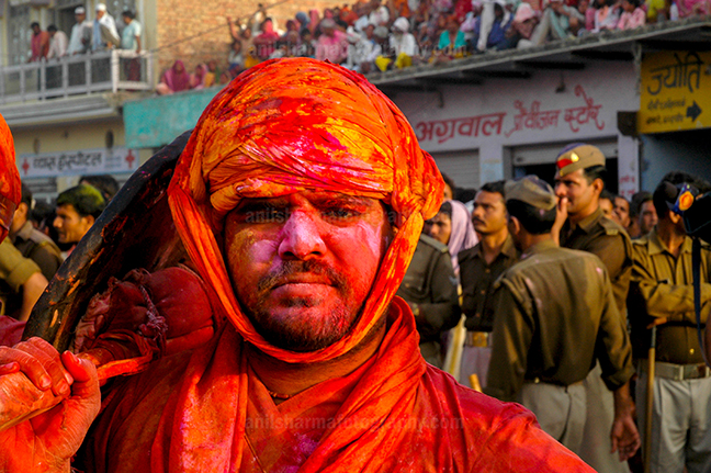 Festivals- Lathmaar Holi of Barsana (India) - A man daubed in color powder during Lathmaar Holi at Barsana, Mathura, Uttar Pradesh, India. by Anil Sharma Photography