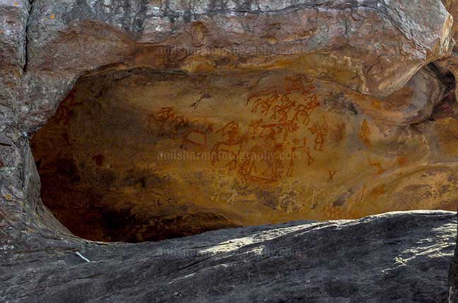 Archaeology- Bhimbetka Rock Shelters - Prehistoric rock painting showing chief of warrior’s leading his team at Bhimbetka. by Anil Sharma Photography