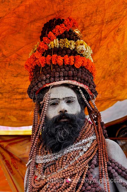 Culture- Naga Sadhu\u2019s (India) - Naga Sadhu with headdress of Rudraksha bead and marigold malas at Varanasi. by Anil Sharma Photography