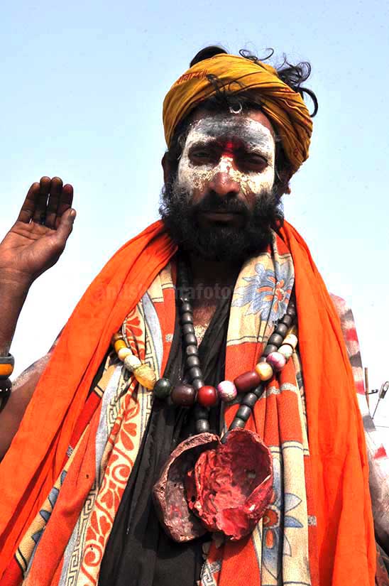 Culture- Aghori Sadhu\'s (India) - Aghori Sadhu with ash on the face, wearing human bones and  rudraksha bead at Mahakumbh Allahabad, Uttar Pradesh (India). by Anil Sharma Photography