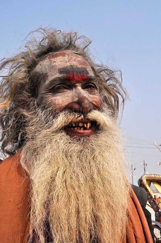 Culture- Aghori Sadhu\'s (India) - Smile of an old Aghori Sadhu with long hairs, ash on face at Mahakumbh Prayag, Allahabad, Uttar Pradesh (India). by Anil Sharma Photography