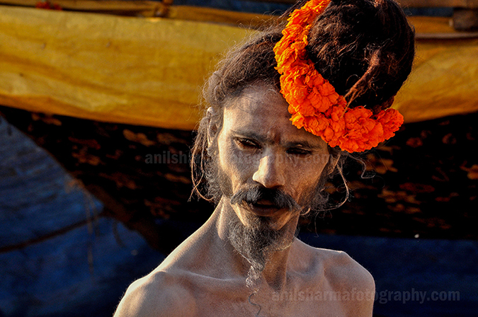 Culture- Naga Sadhu\u2019s (India) - A Naga Sadhu with fancy headdress of marigold flowers at Varanasi Ghats. by Anil Sharma Photography