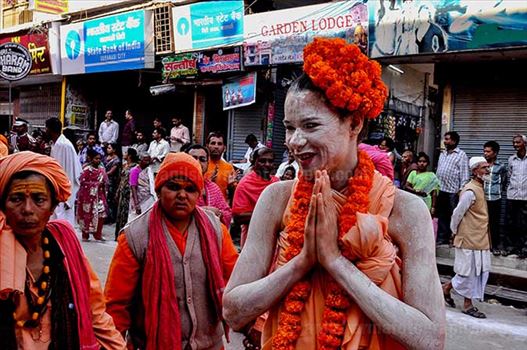 Culture- Naga Sadhu’s (India) - A foreign Women Naga Sadhu greeting local people in Varanasi.