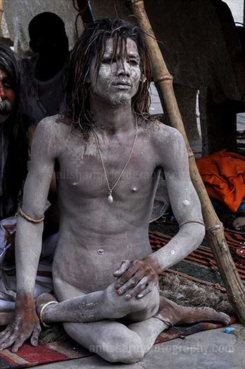 Culture- Naga Sadhu’s (India) - A young Naga Sadhu in Yogic posture at Varanasi Ghat.