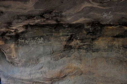 Archaeology- Bhimbetka Rock Shelters - Prehistoric Roak Painting showing hunters riding horses in white color at Bhimbetka.