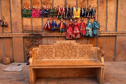Festivals: Jaisalmer Desert Festival Rajasthan (India) - Rajasthani Puppets hanging on the wall.