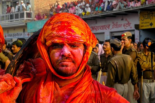 Festivals- Lathmaar Holi of Barsana (India) - A man daubed in color powder during Lathmaar Holi at Barsana, Mathura, Uttar Pradesh, India.