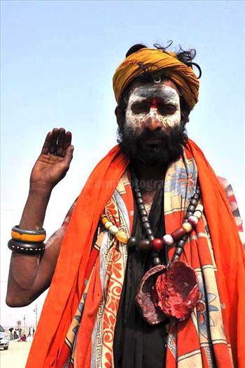Aghori Sadhu with long hairs, ash on the face, wearing human bones and  rudraksha bead at Mahakumbh Allahabad, Uttar Pradesh (India).