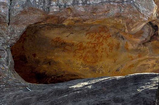 Archaeology- Bhimbetka Rock Shelters - Prehistoric rock painting showing chief of warrior’s leading his team at Bhimbetka.