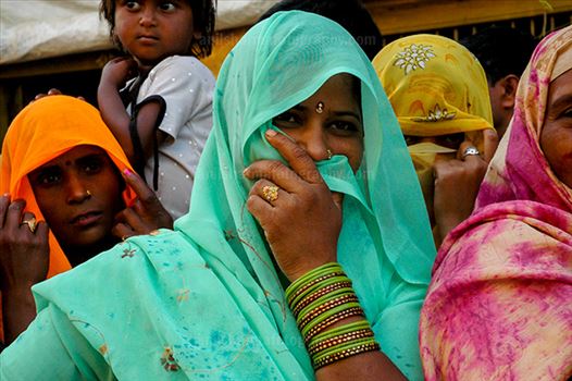 A local women covering her face with her saree at Barsana, Mathura, Uttar Pradesh, India.