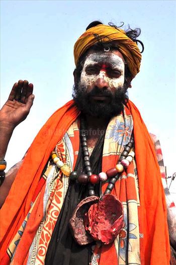 Aghori Sadhu with ash on the face, wearing human bones and  rudraksha bead at Mahakumbh Allahabad, Uttar Pradesh (India).