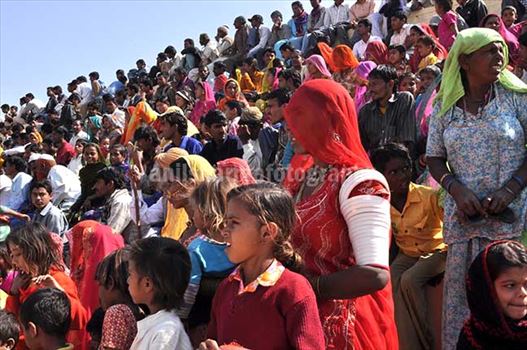Local people enjoying women's matkaa race at Jaisalmer desert fair.